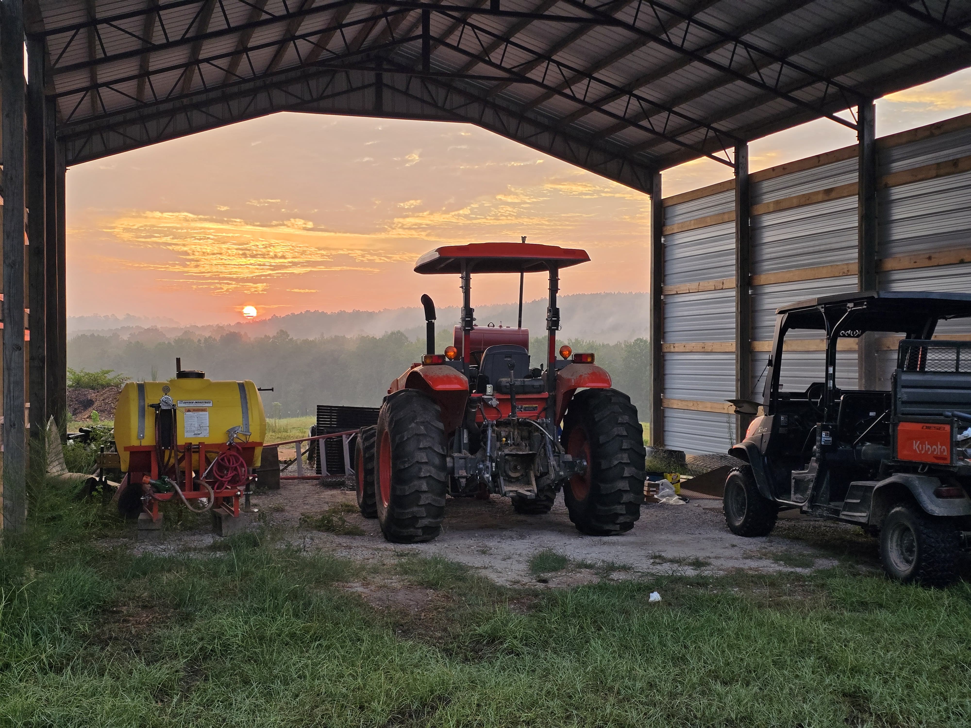 Daily farm operations with tractor and outbuilding